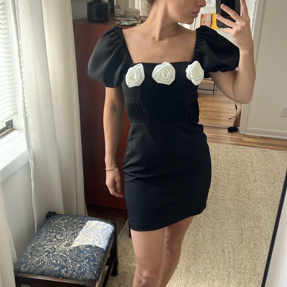 Black dress with white rosettes